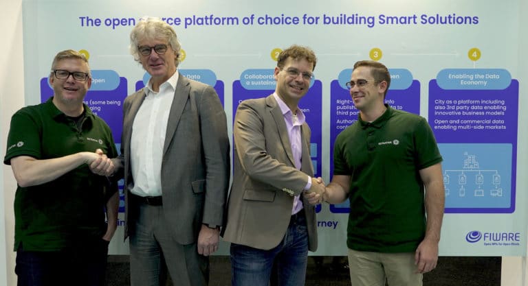 Robert and Morgan from Sensative shaking hands with the left Albert Seubers, Director Global Strategy IT in Cities, Atos and FIWARE Foundation CEO, Ulrich Ahle